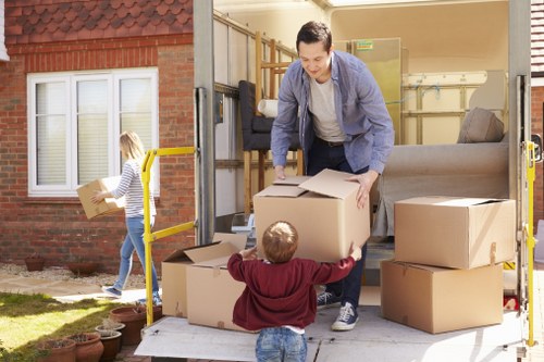 Removal team supporting a local move in Hither Green with packed boxes and furniture