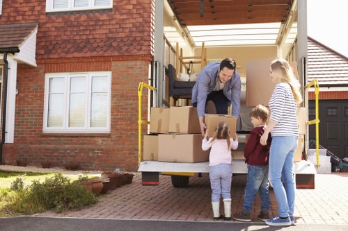 Home moving service in Hither Green with packed boxes and removal van