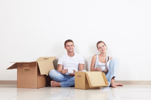 Unpacking support in a Hither Green home with boxes being arranged room by room