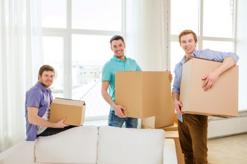 Local removals team planning a house move on a Hither Green street