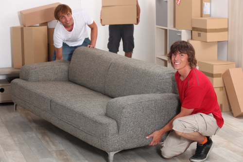 Commercial movers preparing packed office items for transport in Hither Green