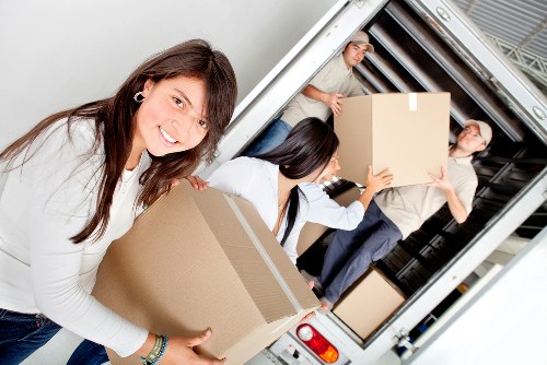 Loading household furniture into a removals van
