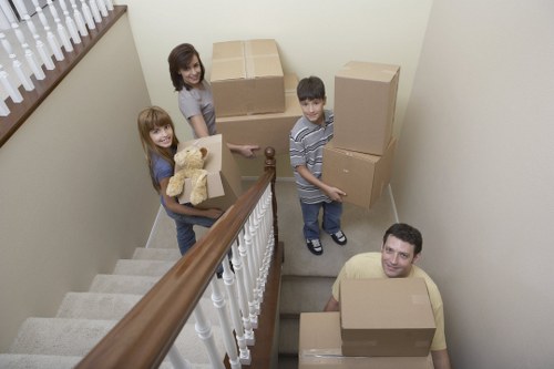 Loading furniture and boxes into a removal van in Hither Green